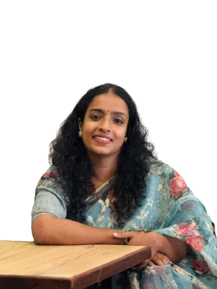 Sruthy, digital marketer working at her desk, focused on a marketing project.best freelance digital marketer in calicut